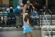 Samantha's father (Robert Dominick Jones) and her coach (Joe Amato) give high-fives to Samantha (Valerie Gardner).