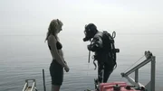Emily Riedel watches Daryl Galipeau as he readies himself for a dive.