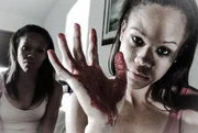Jas and Tas with bloody hands.