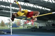 ESSEX, U.K. - The high jumper demonstrates how to Frosby Flop. She arches her back and gets her center of gravity high enough to clear the bar. â€¨â€¨(photo credit:  National Geographic Channels/Nick Marwick)