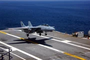 A F-14 Tomcat comes in for a landing on the flight deck of the USS Ronald Reagan. A F-14 Tomcat comes in for a landing on the flight deck of the USS Ronald Reagan.