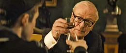 Gary 'Eggsy' Unwin (Taron Egerton), Arthur (Michael Caine)