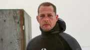 Captain Kris Kelly after a dive under the ice.