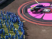 MrBeast explains the rules of the game in front of the helicopter.