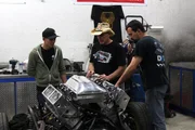 Azn, Farmtruck and Jeremy Wagler check out the new motor for the Haunted Hearse.
