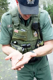 Officer Jacobson showing off a little lizard while filming.