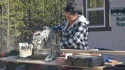 Tiny house builder Shelby Catron works on cutting lumber as she assists her husband Chad in building an off the grid tiny house for them and their three children on their 20 acre property in Spirit Lake, Idaho, as seen on Tiny House, Big Living.