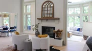 The Downey family home looks stunning with the fireplace and seating as what draws one upon entering.