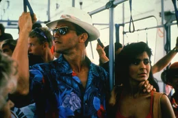 l-r: Ben Richards (Arnold Schwarzenegger), Amber Mendez (Maria Conchita Alonso)