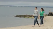 As seen on HGTV's Beach Hunters, homebuyer Sarah and friend Lora enjoy an afternoon stroll on the beach. As seen on HGTV's Beach Hunters, homebuyer Sarah and friend Lora enjoy an afternoon stroll on the beach.