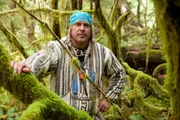 USA, Washington, Olympic National Forest, Portrait of Cody Lundin walking through Pacific Northwest rainforest during Dual Survivor filming USA, Washington, Olympic National Forest, Portrait of Cody Lundin walking through Pacific Northwest rainforest during Dual Survivor filming