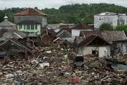 Damaged houses and debris are seen after a tsunami in this aerial photo taken in Sumur, Pandeglang, Banten province, Indonesia, on Tuesday, Dec. 25, 2018. The death toll from a tsunami along Indonesias Sunda Strait exceeded 400 as rescuers scour through the wreckage of hundreds of hotels and houses flattened by the deadly wave.