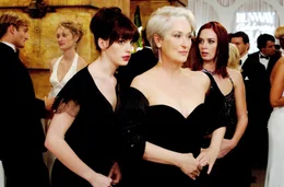 Andy (Anne Hathaway, left) whispers some important information to her boss, fashion magazine editor Miranda Priestly (Meryl Streep), as Miranda's first assistant, Emily (Emily Blunt) looks on. PHOTOGRAPHS TO BE USED SOLELY FOR ADVERTISING, PROMOTION, PUBLICITY OR REVIEWS OF THIS SPECIFIC MOTION PICTURE AND TO REMAIN THE PROPERTY OF THE STUDIO. NOT FOR SALE OR REDISTRIBUTION.