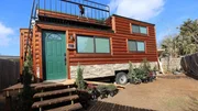 The finished exterior of Chad Steen's tiny smart home is a contrast in itself, with it's warm, inviting log cabin style exterior, complimented by the highly technological and sleek, modern interior, in Plano, Texas, as seen on Tiny House, Big Living.