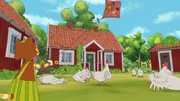 Findus ärgert die Hühner, indem er seinen Windvogel knapp über ihre Köpfe fliegen lässt.