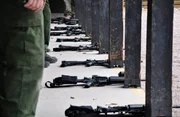 Nogales, Arizona, USA: Weapons lined up on the ground at the firing range where Customs and border protection agents train.