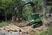 Processor approaching wood as seen on episode one of American Loggers.