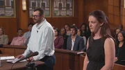 A man and woman standing in courtroom A man and woman standing in courtroom
