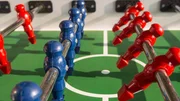 Table football game with red and blue players team