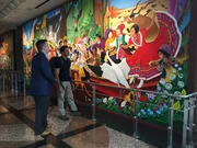 Rob Nelson examines a mural in the Denver International Airport with Heath Montgomery. Rob Nelson examines a mural in the Denver International Airport with Heath Montgomery.