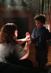Gretchen teaching Shawn a cruel lesson about fire by sticking his hand under a lighter so he could feel the burn.