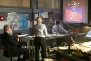 RE-ENACTMENT - Bouillard (played by Stuart Clow) sits at the head of the table and watches the projected navigation animation of ADI showing the place was banking when hit, other investigators (played by background preformers) look on.