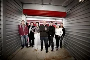 The cast of Storage Wars Canada (from left to right: Bogart, Paul, Ursula, Don, Roy, Cindy, Rick)