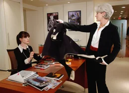 Imperious fashion magazine editor Miranda Priestly (Meryl Streep) dumps her coat on the desk of new assistant Andy Sachs (Anne Hathaway). PHOTOGRAPHS TO BE USED SOLELY FOR ADVERTISING, PROMOTION, PUBLICITY OR REVIEWS OF THIS SPECIFIC MOTION PICTURE AND TO REMAIN THE PROPERTY OF THE STUDIO. NOT FOR SALE OR REDISTRIBUTION.