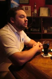 Toby Holt grabbing a drink at the bar.