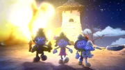 Poppy, Blüte, Baby und Handy verlassen Gargamels Schlupfwinkel, nachdem sie ihn erneut in seine Grenzen gewiesen haben.
