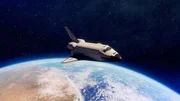 CGI IMAGE: Spaceship in space with Earth in the background.
