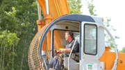 Bobby operating the backhoe.