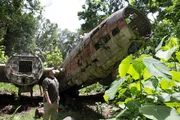 Mark Waycaster inspects the wreckage of a Mistubishi G4M Betty Bomber on Ballalai Island, Solomon Islands. Mark Waycaster inspects the wreckage of a Mistubishi G4M Betty Bomber on Ballalai Island, Solomon Islands.