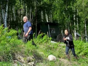 Stan and Katlyn Zuray walking up the hill to their fish camp.