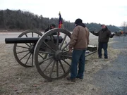 Chris, Paul and the instructor with a cannon at cannon school held at the NSSA Headquarters.