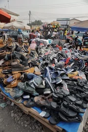 Pile of shoes in a street market.