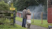 Young Karl and Cindy Best look at the destroyed farm.