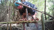 Cody Lundin cooking a Python snake. Cody Lundin cooking a Python snake.