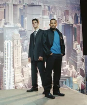 L-R: Donald Flack (Eddie Cahill), Dr. Sheldon Hawkes (Hill Harper)