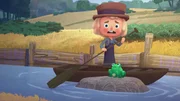 Bauer Juro will einem Frosch ins Wasser helfen.
