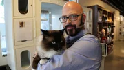 Jackson holding a cat.