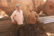 L-R: Andreas and Tobi Macherey in front of a huge Loader. L-R: Andreas and Tobi Macherey in front of a huge Loader.