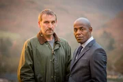 Robert (Christopher Eccleston, l.) und Mark (Paterson Joseph, r.).