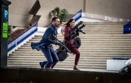 Darling (EIZA GONZALEZ) and Buddy (JON HAMM) are on the chase in TriStar Pictures' BABY DRIVER.