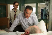 Gideon and Dr. Daniel Reid (Matthew Gray Gubler, left and Mandy Patinkin, center) question Gil Clurman (Tom Virtue), the victim of a serial bomber, on CRIMINAL MINDS (Episode: "Won't Get Fooled Again").