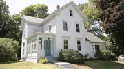The newly renovated front exterior from the home that was built in 1873 that Jon Knight renovated with his team as seen on HGTV's Farmhouse Fixer.