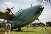 Professor Tosh Minohara inspects a Kawanishi H8K 'Emily' Seaplane in Kanoya Airbase Museum, Japan. Professor Tosh Minohara inspects a Kawanishi H8K 'Emily' Seaplane in Kanoya Airbase Museum, Japan.
