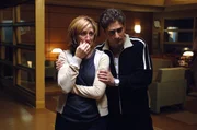 Medium shot standing in waiting area, of Edie Falco as Carmela Soprano crying and Michael Imperioli as Christopher Moltisanti comforting her. Medium shot standing in waiting area, of Edie Falco as Carmela Soprano crying and Michael Imperioli as Christopher Moltisanti comforting her.