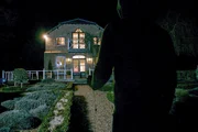 A figure watches Morgan's house.
