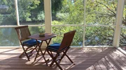 The outdoor seating area of the Aqua Oasis home.
